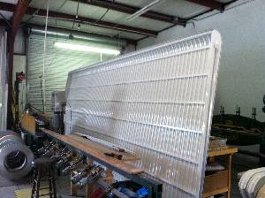 large clamshell aluminum awning