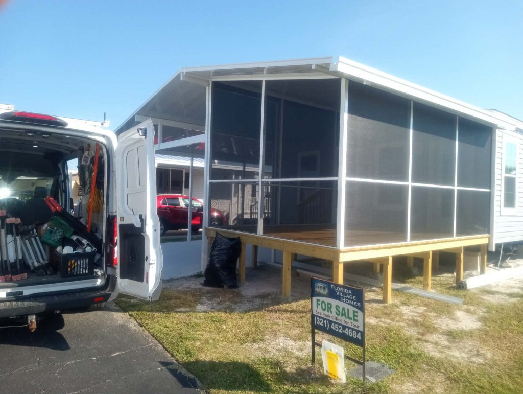 Screen room with attached carport built on new home in Merritt Island Florida