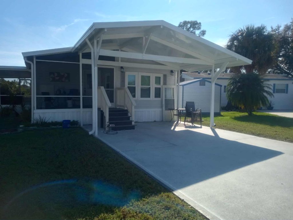 Completed aluminum carport at Great Outdoors Complex showing posts beams and roof panels