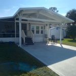 Completed aluminum carport at Great Outdoors Complex showing posts beams and roof panels
