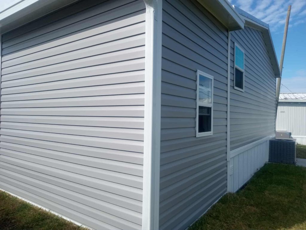 Side view of wood frame shed construction with aluminum roof panels in Cocoa