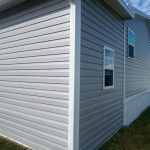 Side view of wood frame shed construction with aluminum roof panels in Cocoa