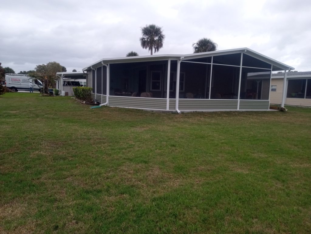 Rear view of insulated room addition wrapping around back of house in Cocoa Florida