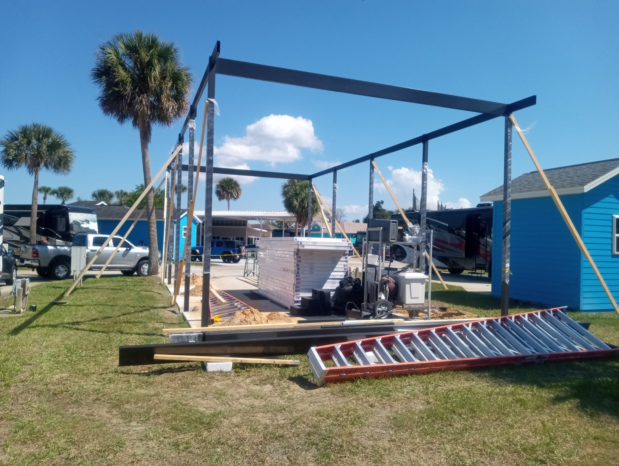 Framing progress on 22 by 42 foot motorhome carport with 4x4 structural posts in Titusville