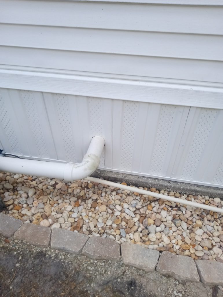 New white vented vinyl skirting installed on mobile home at The Great Outdoors in Titusville Florida