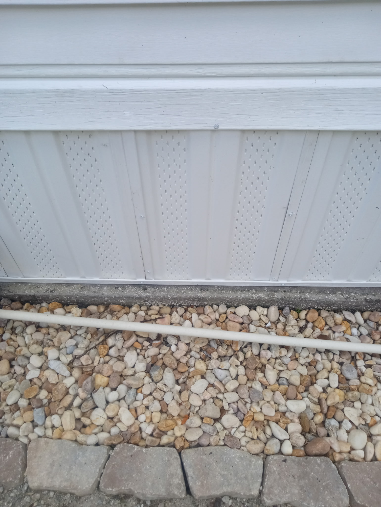 New white vented vinyl skirting installed on mobile home at The Great Outdoors in Titusville Florida