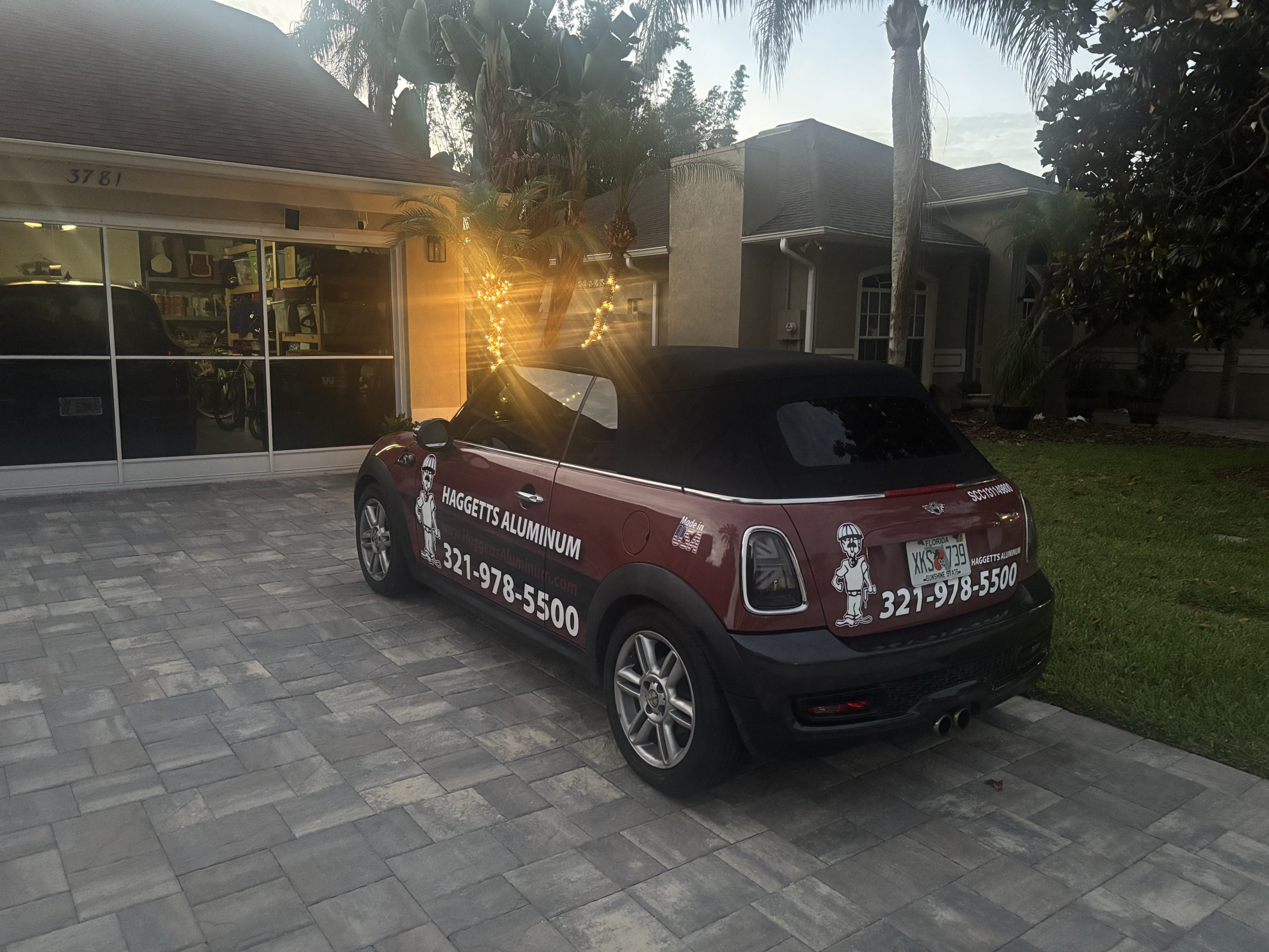 Haggetts Aluminum branded Mini Cooper parked in a Central Florida driveway