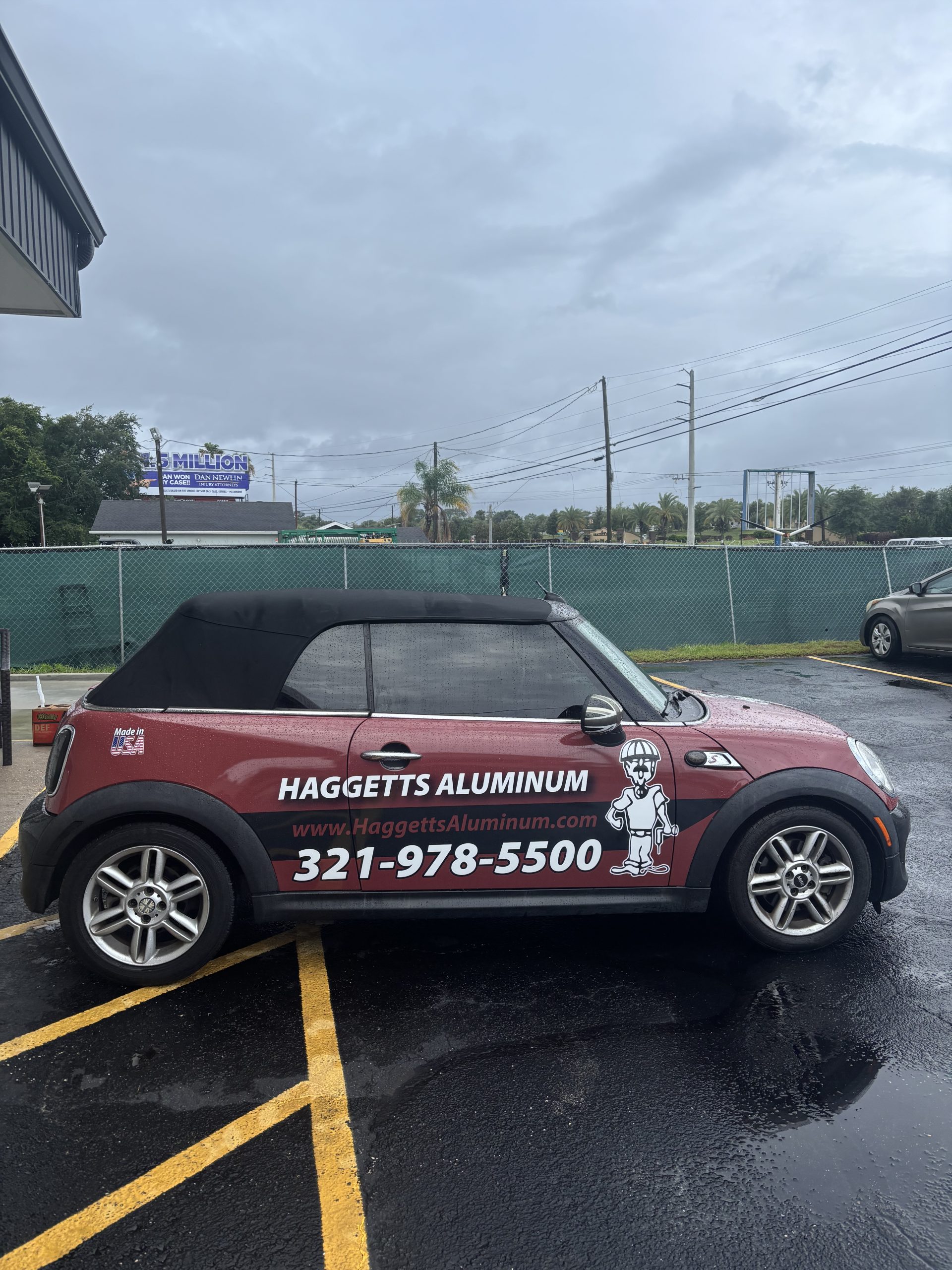 Haggetts Aluminum branded Mini Cooper parked in a lot in Central Florida