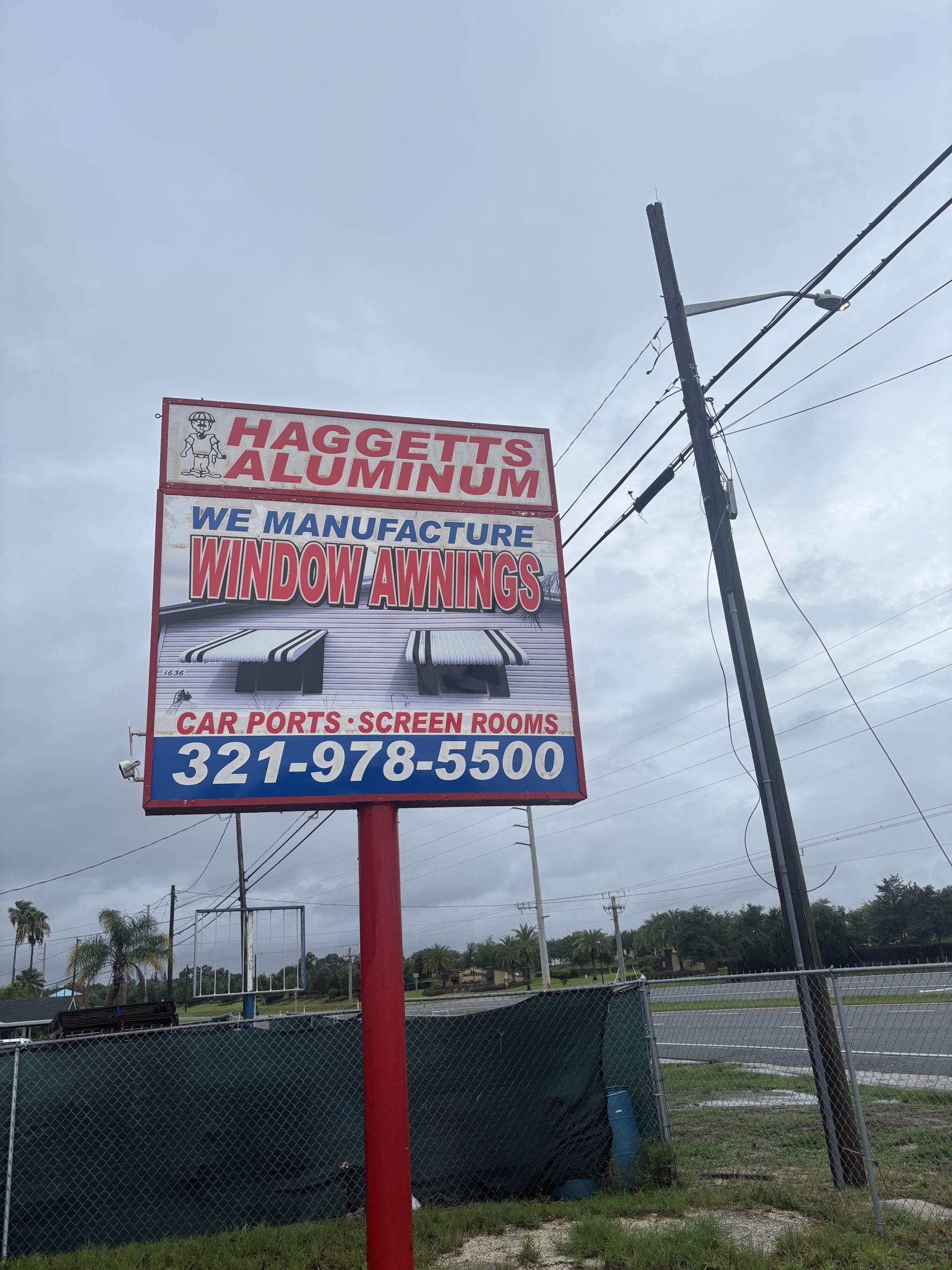Haggetts Aluminum roadside sign advertising window awnings, carports and screen rooms, phone 321-978-5500