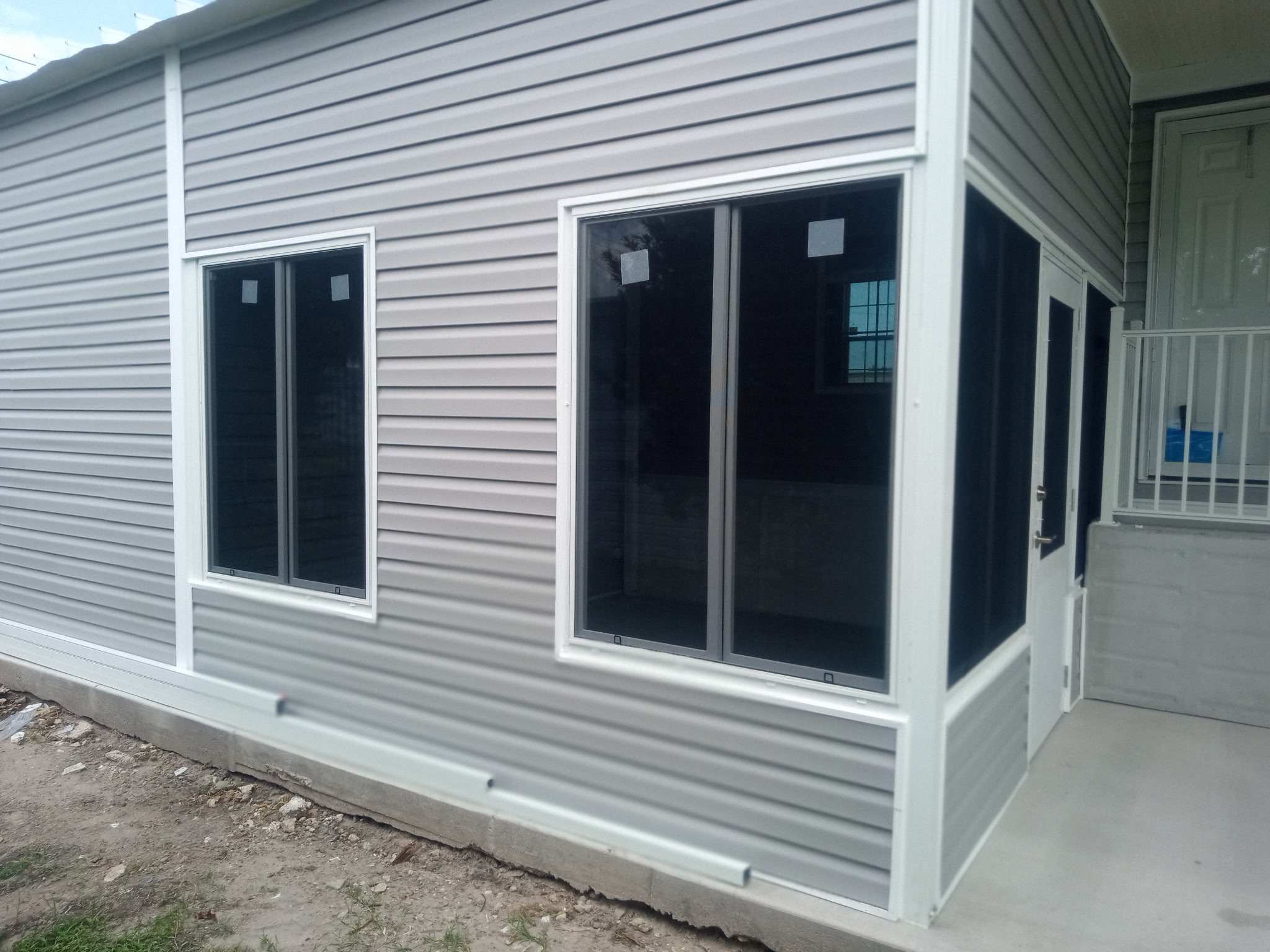 Wide view of shed Florida room and carport addition nearing completion in Barefoot Bay