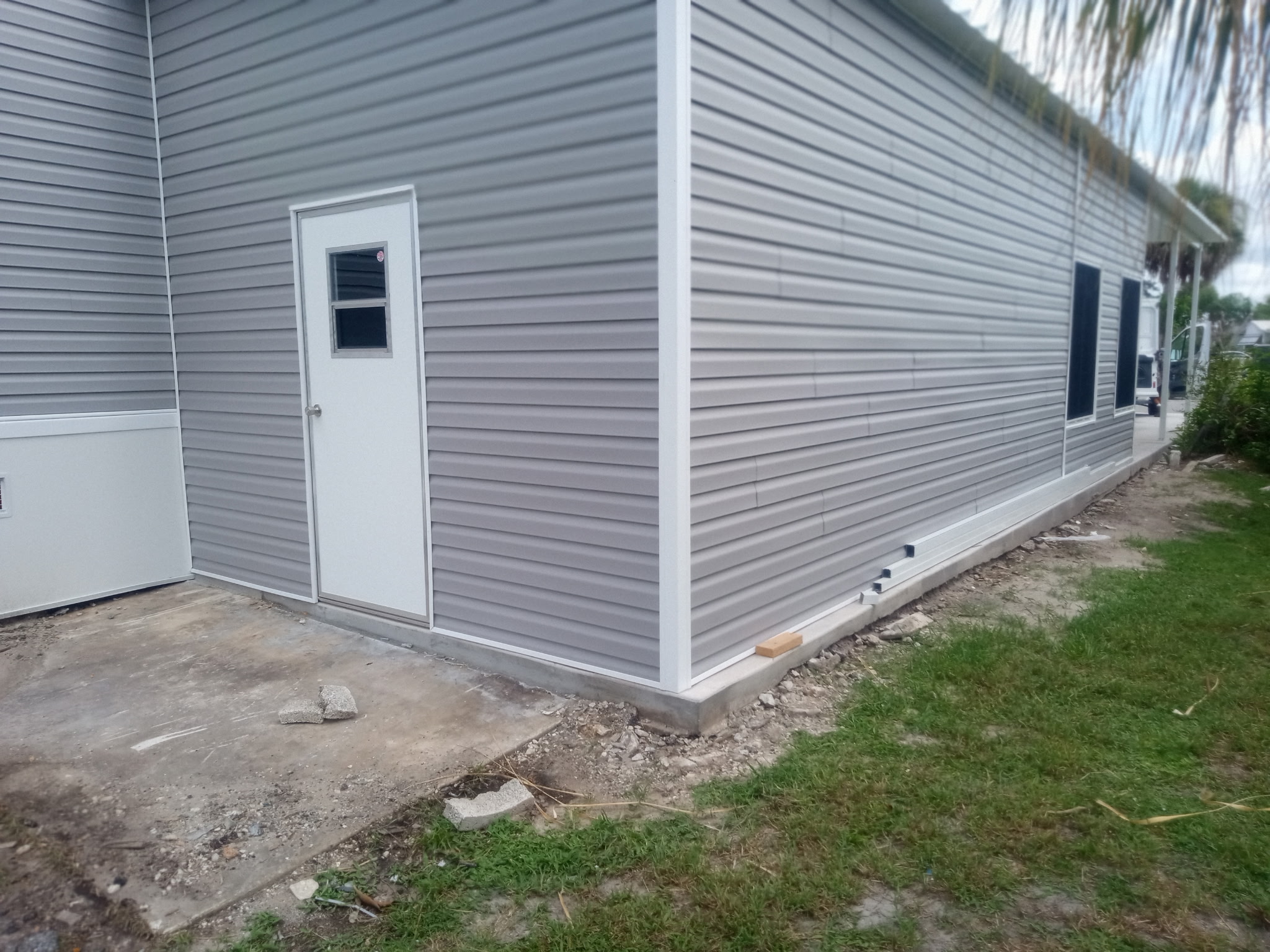 Close-up view of glass sliding window installation on Florida room in Barefoot Bay Florida